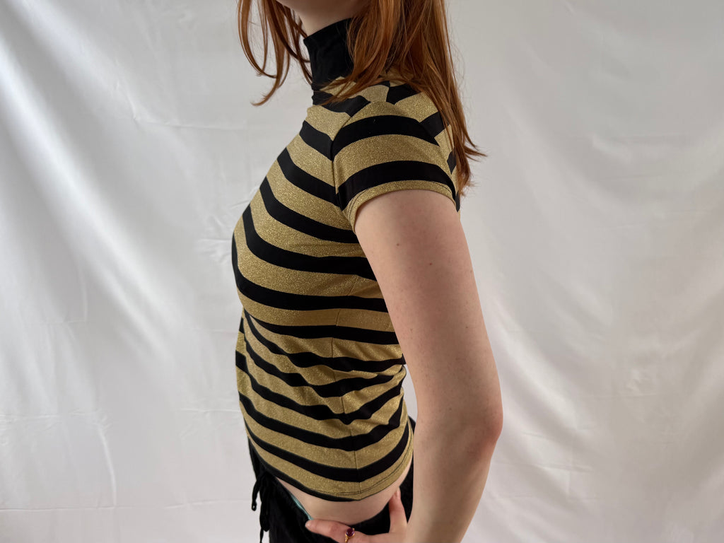 Striped gold and black turtleneck top