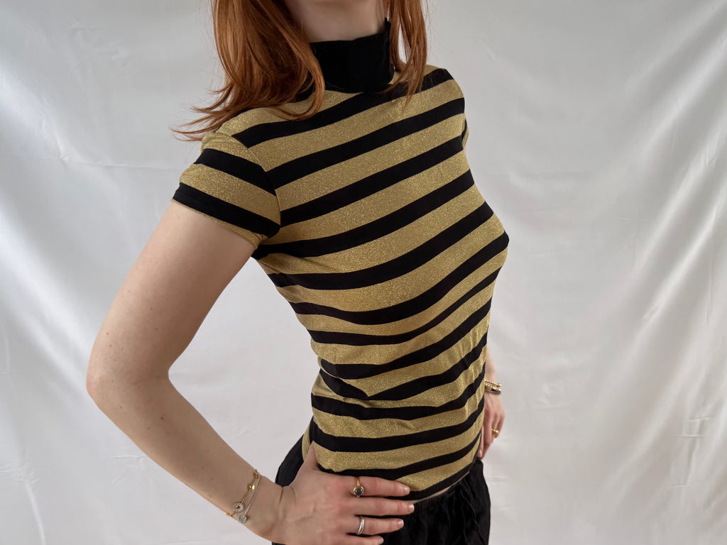 Striped gold and black turtleneck top