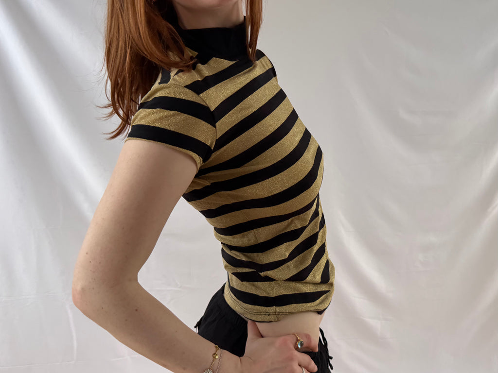 Striped gold and black turtleneck top