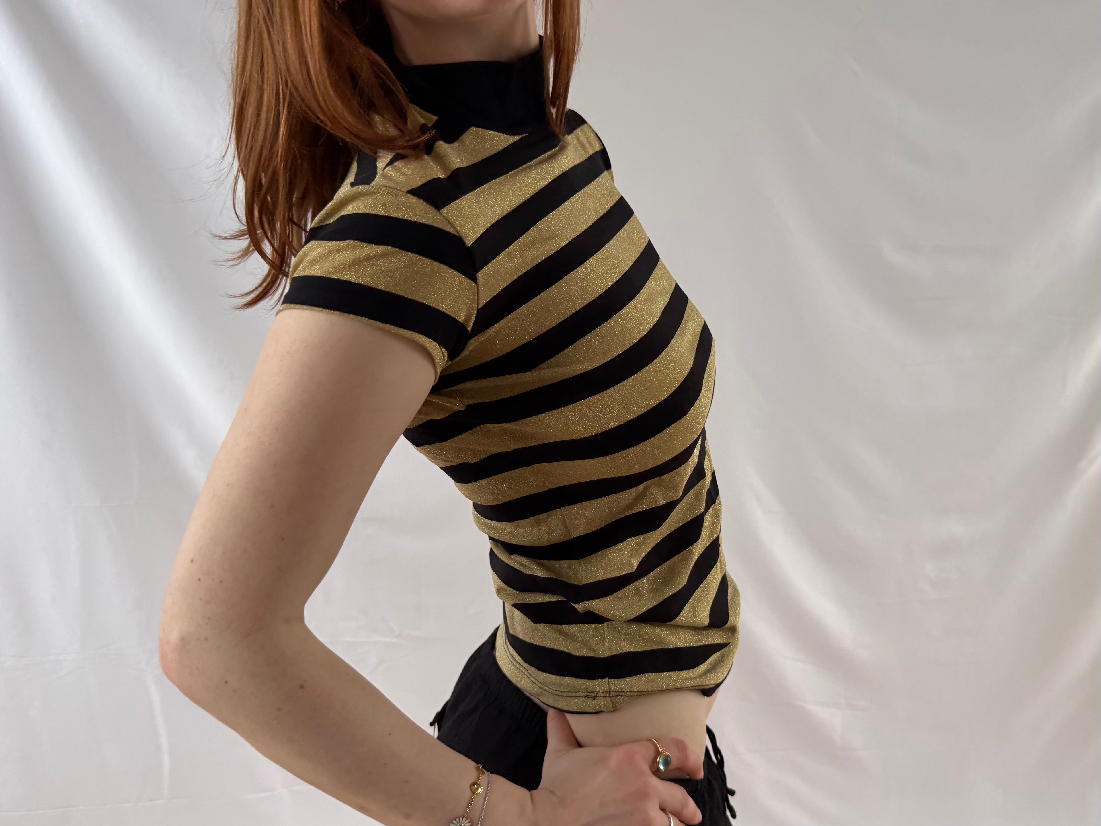 Striped gold and black turtleneck top