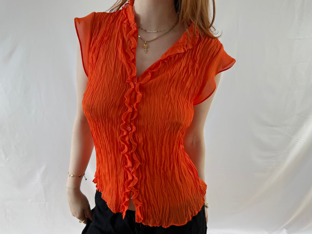 Orange skjorte med frynser