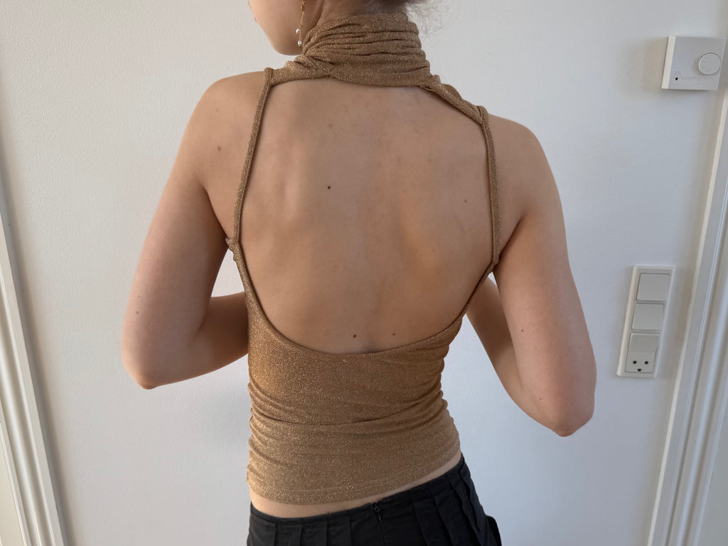 Gold open-back turtleneck