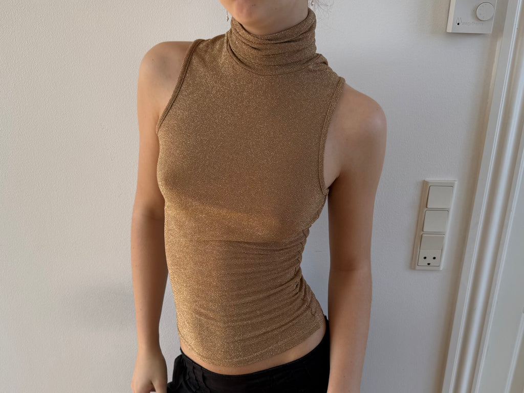 Gold open-back turtleneck