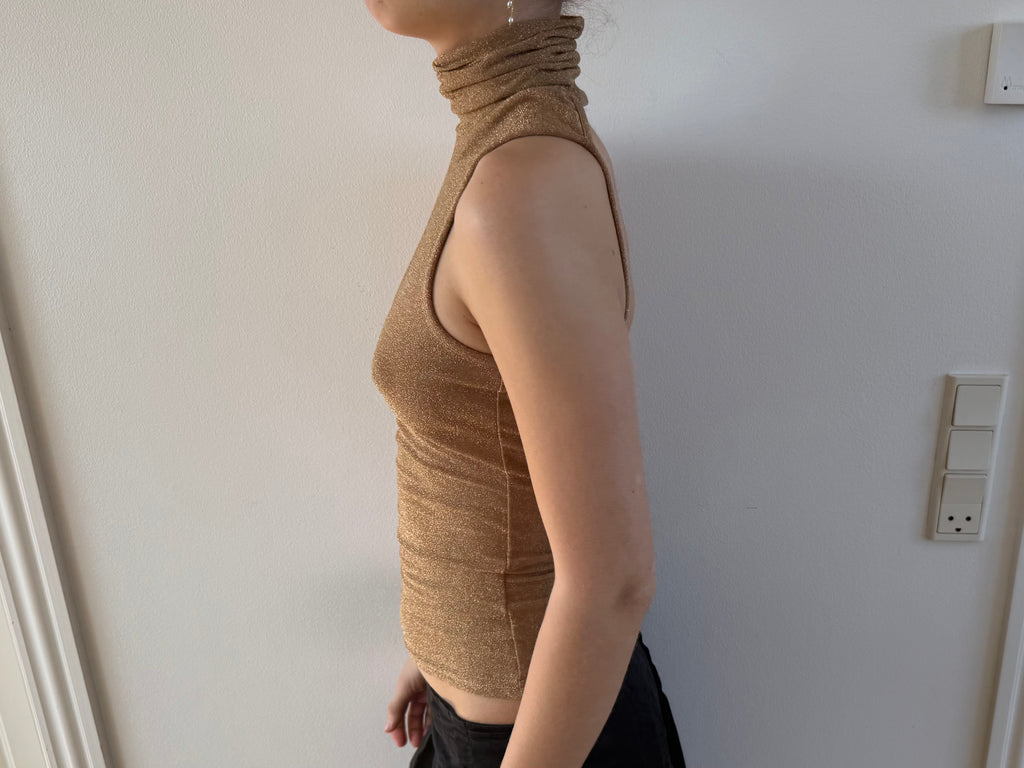 Gold open-back turtleneck