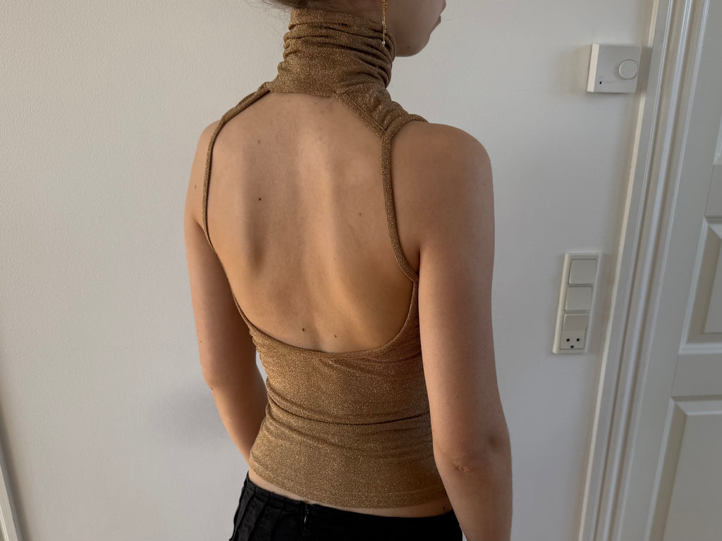 Gold open-back turtleneck
