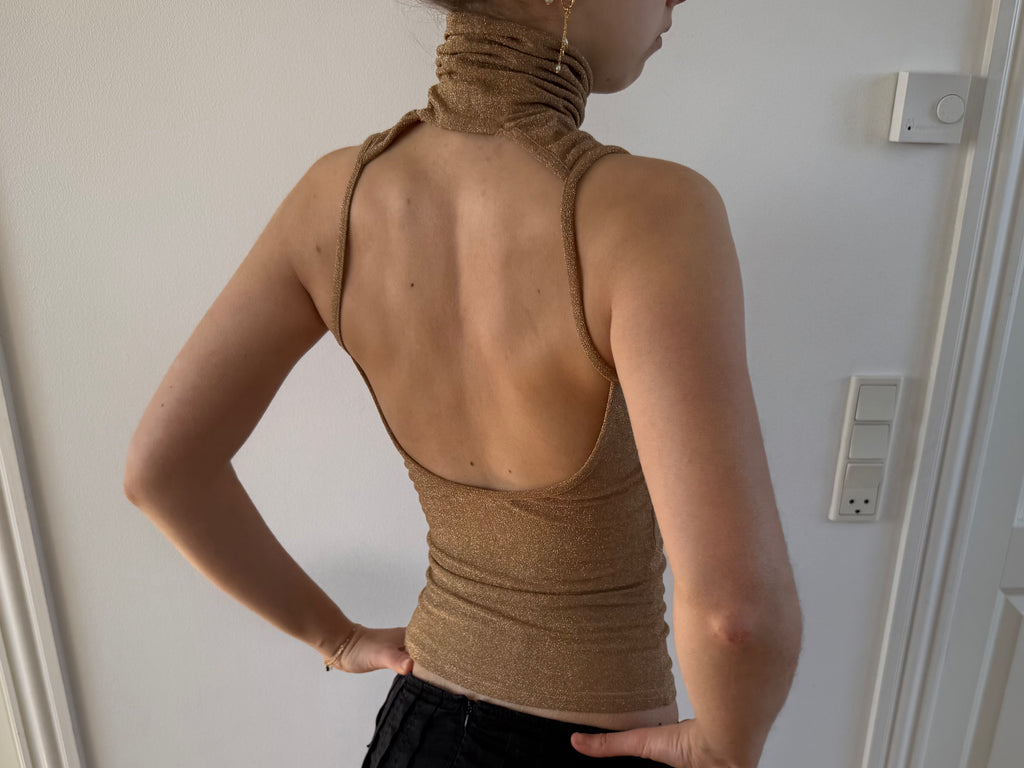 Gold open-back turtleneck